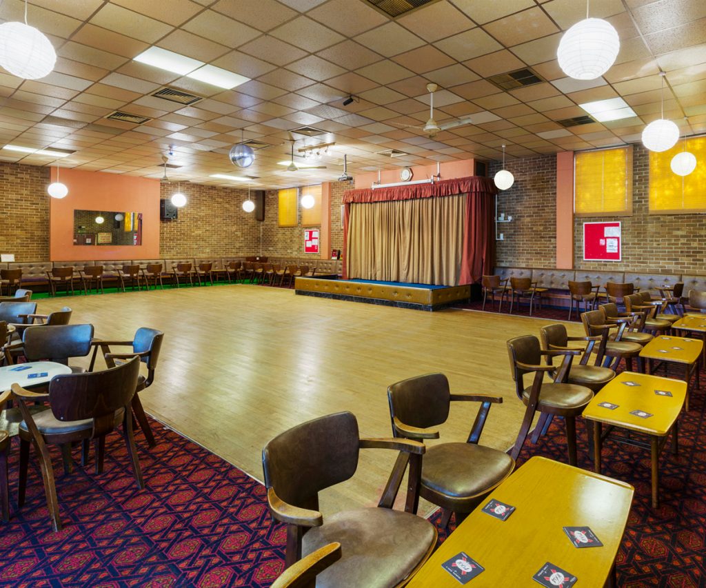 a room with tables and chairs