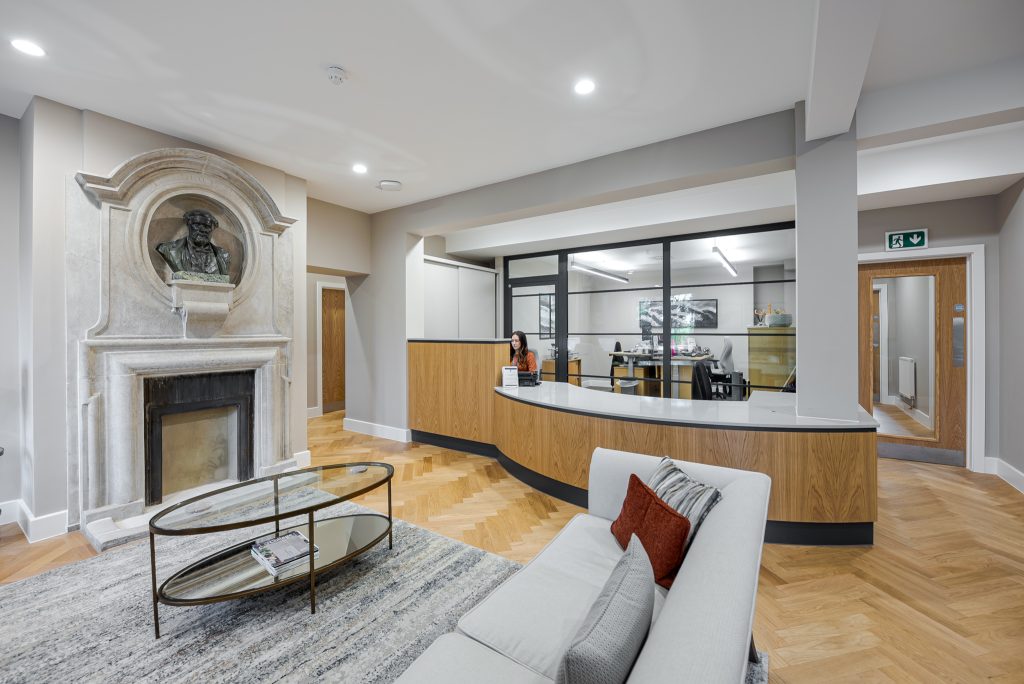 a living room filled with furniture and a fireplace