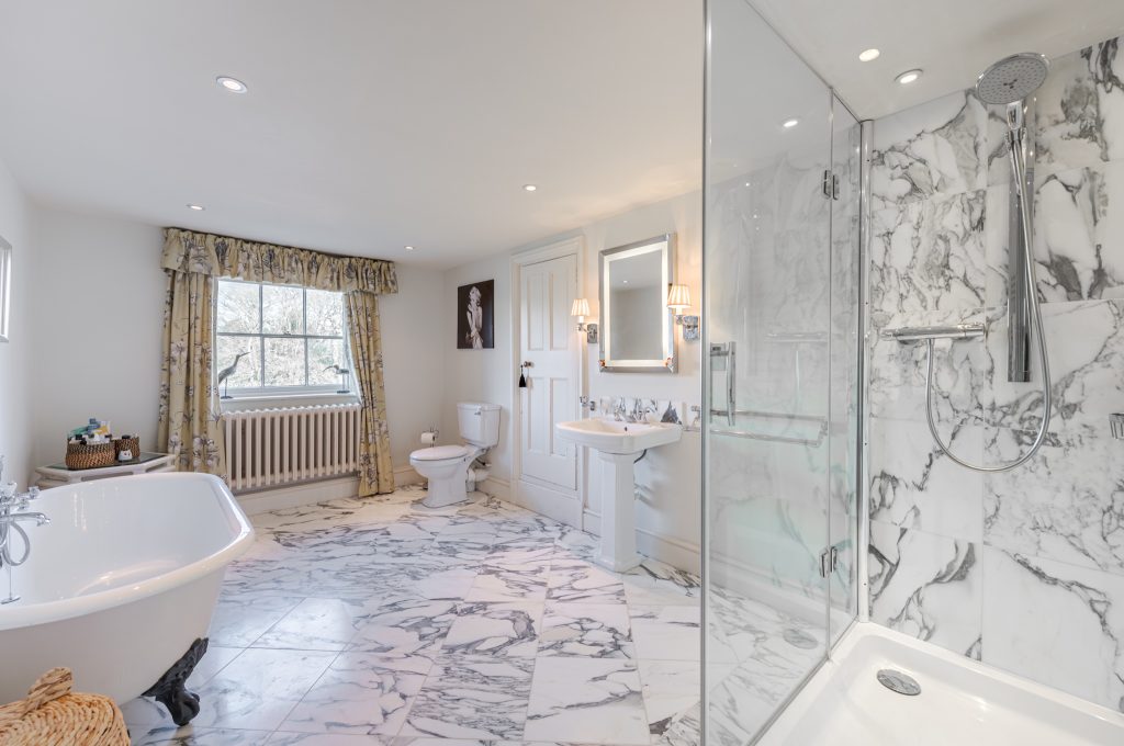 a room with a sink and a bath tub