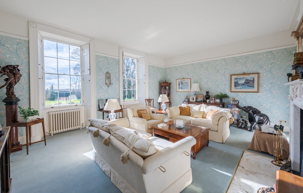 a living room filled with furniture and a fire place
