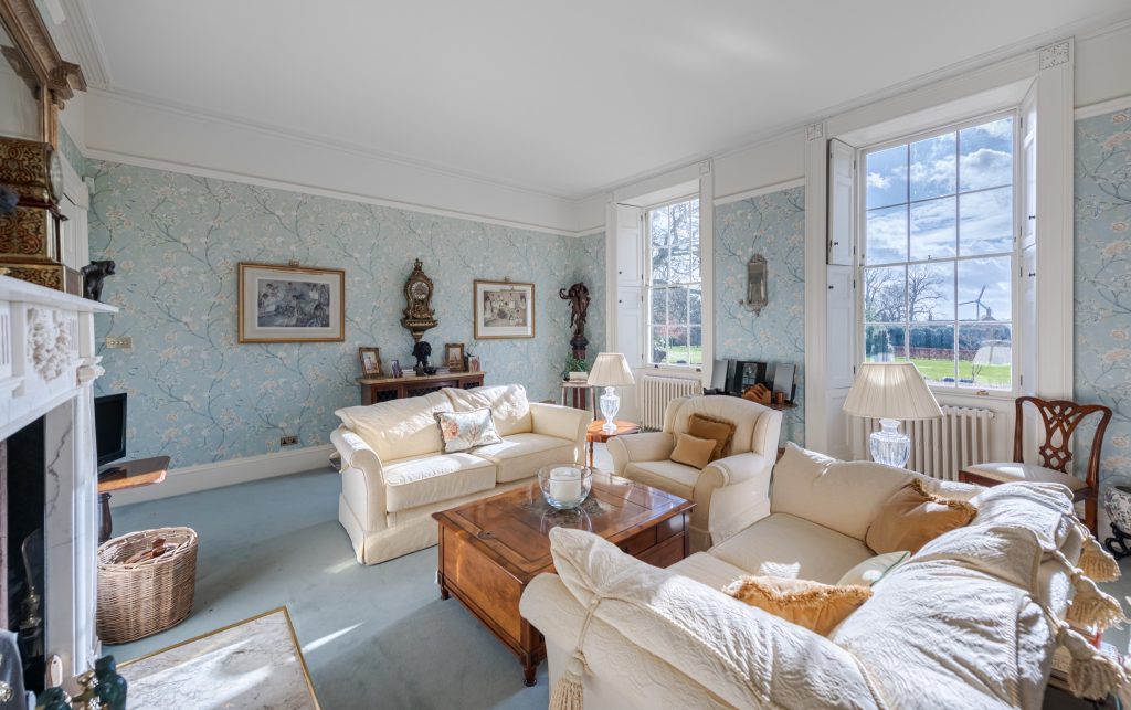 a living room filled with furniture and a fire place