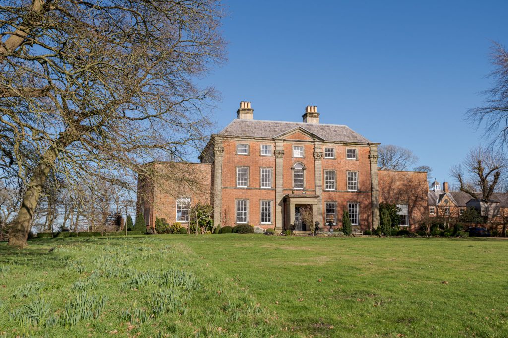 a castle on top of a grass covered field