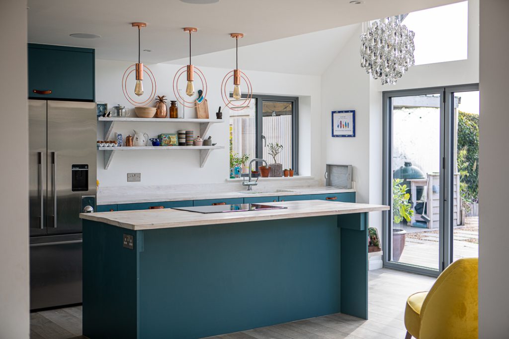 a kitchen with an island in the middle of a room