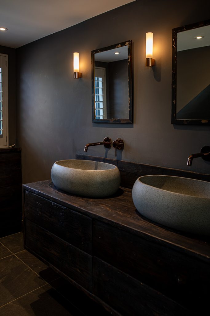a double sink and large mirror