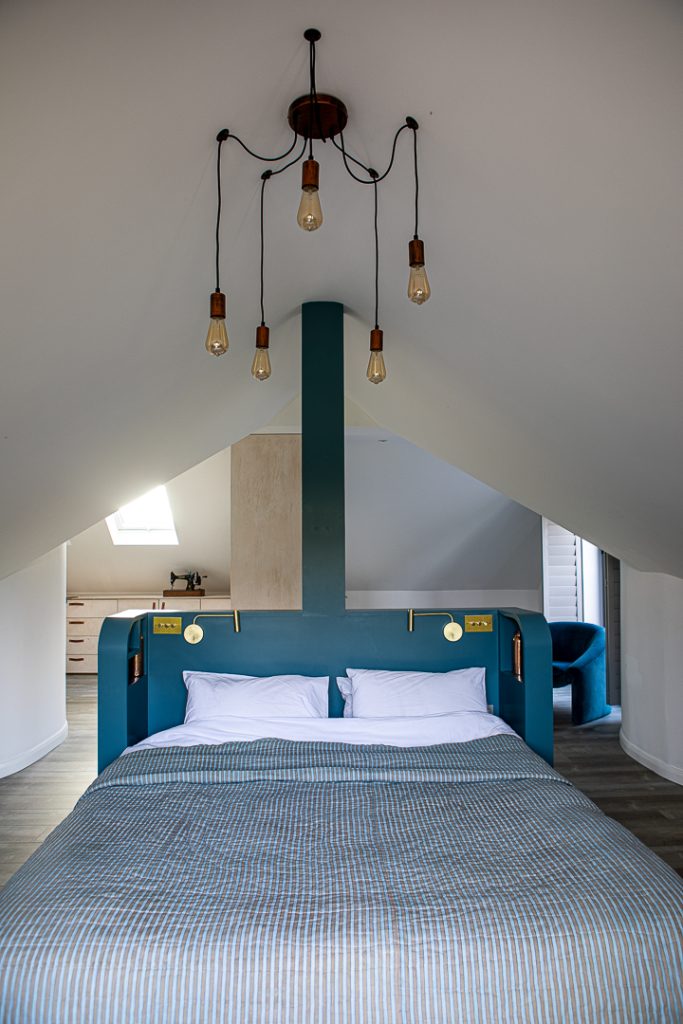 a bedroom with a large bed in a room