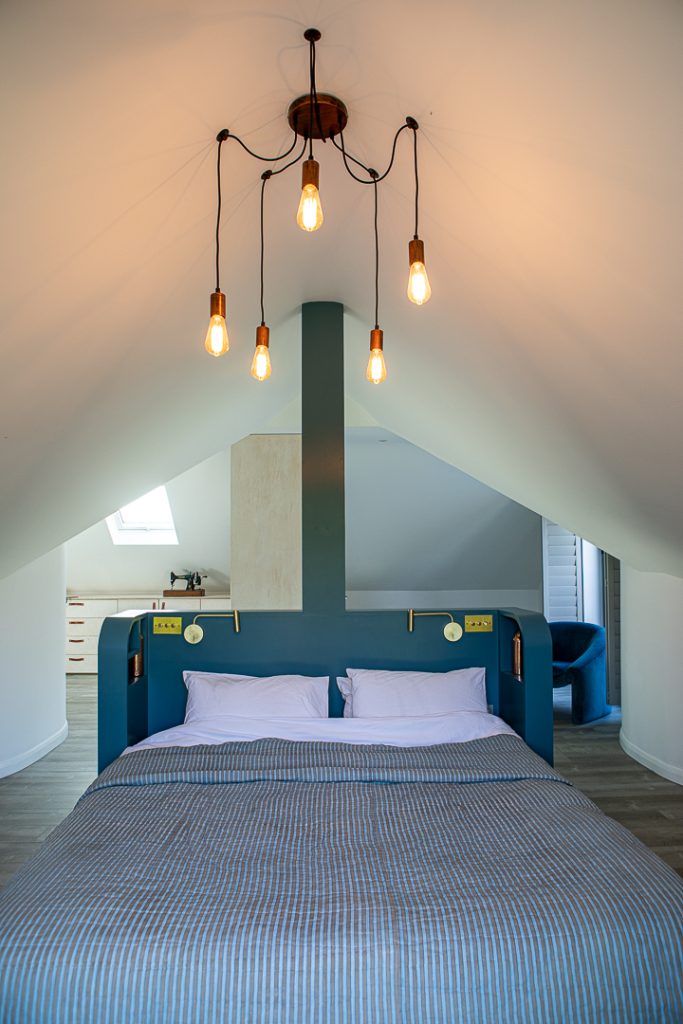a bedroom with a large bed in a room