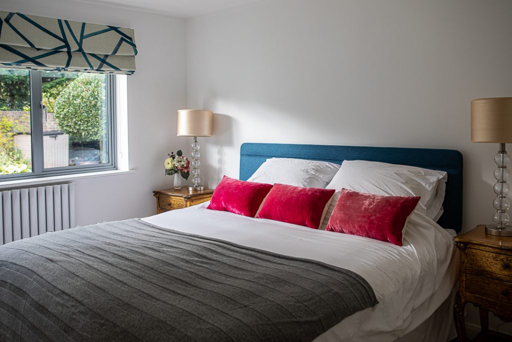 a bedroom with a large bed in a hotel room