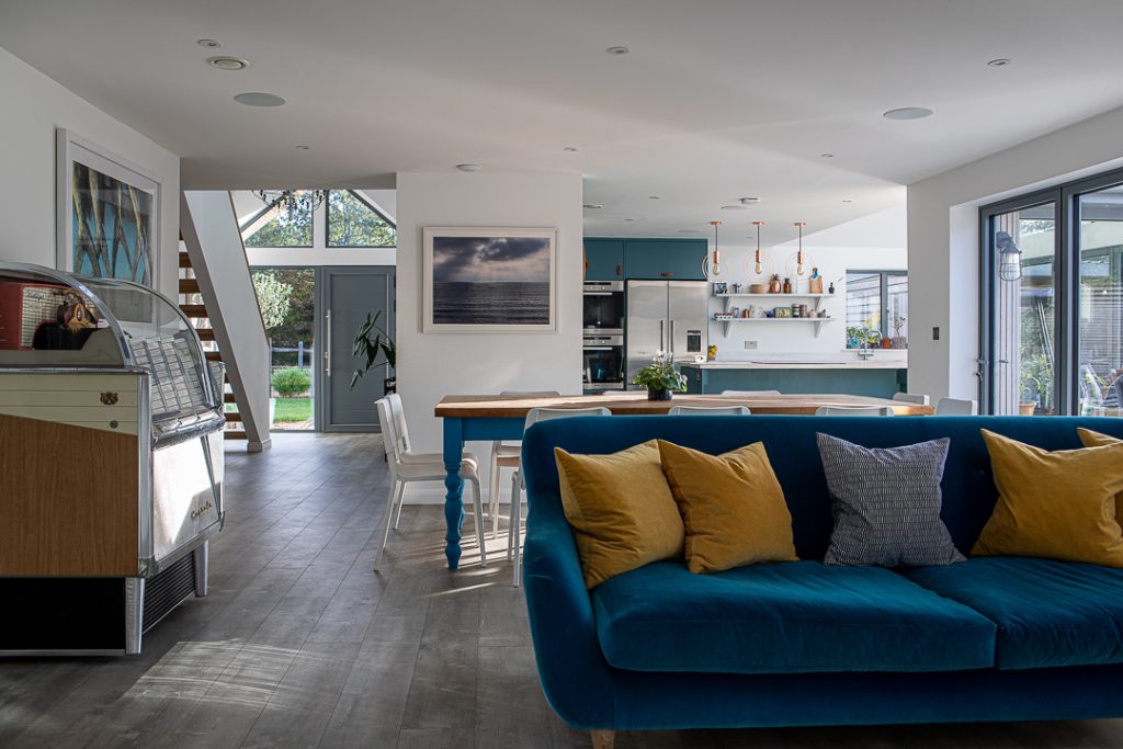 a living room filled with furniture and a large window