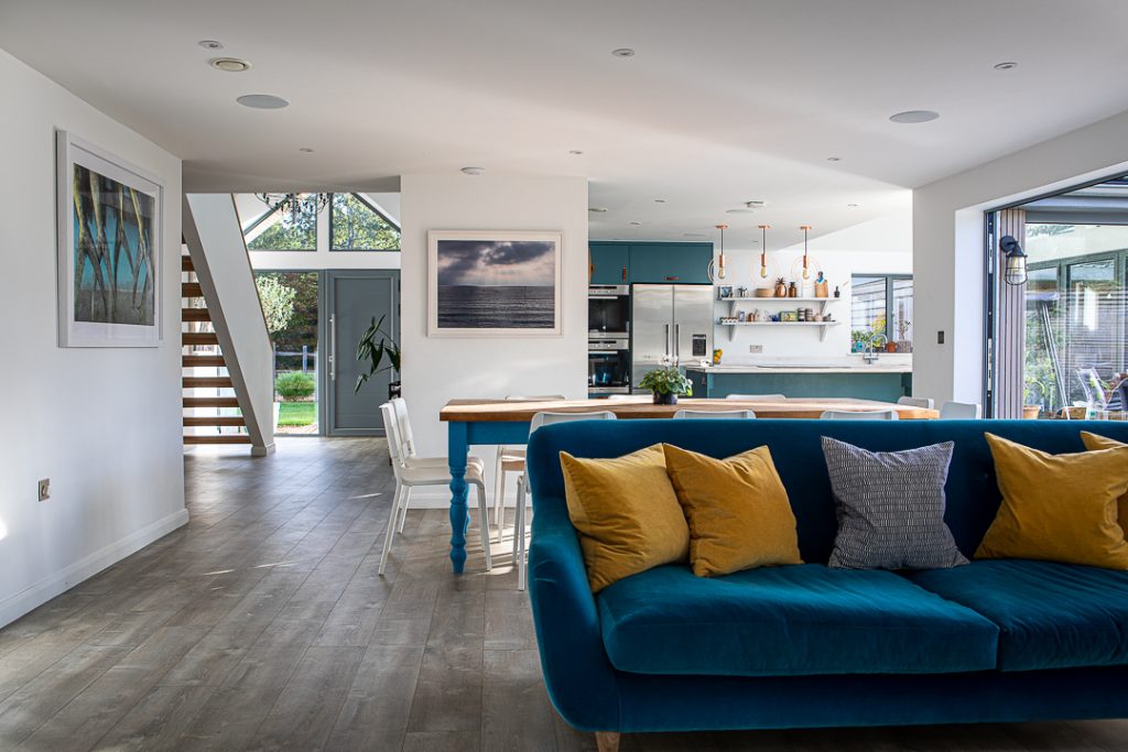 a living room filled with furniture and a large window