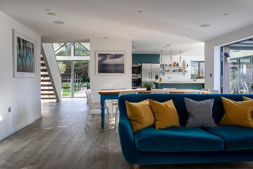 a living room filled with furniture and a large window