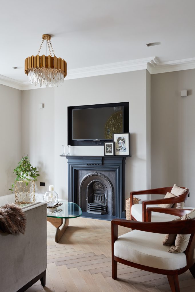a living room filled with furniture and a fireplace