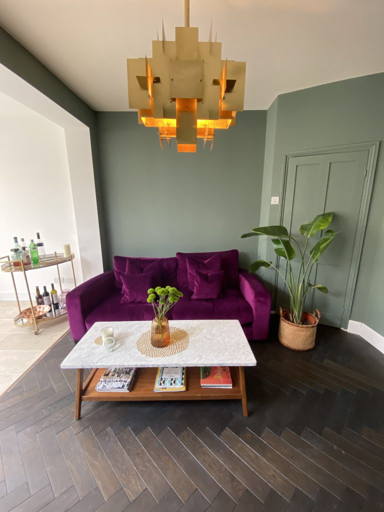 a living room with a purple flower