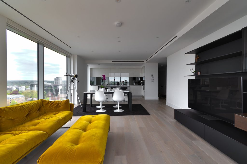 a room filled with furniture and a large window