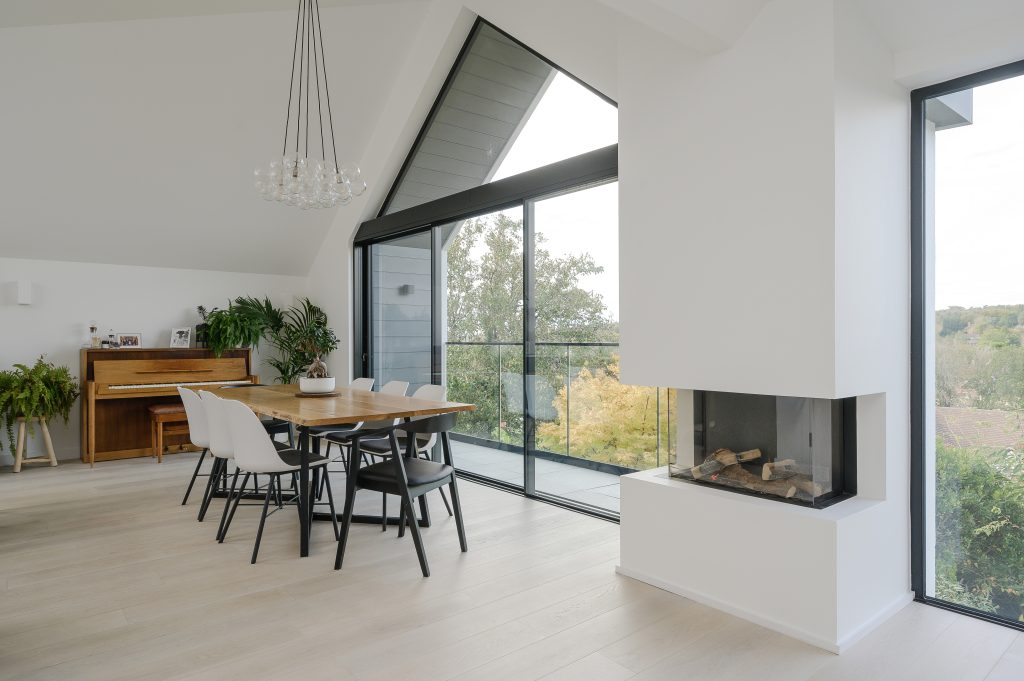 a living room filled with furniture and a large window