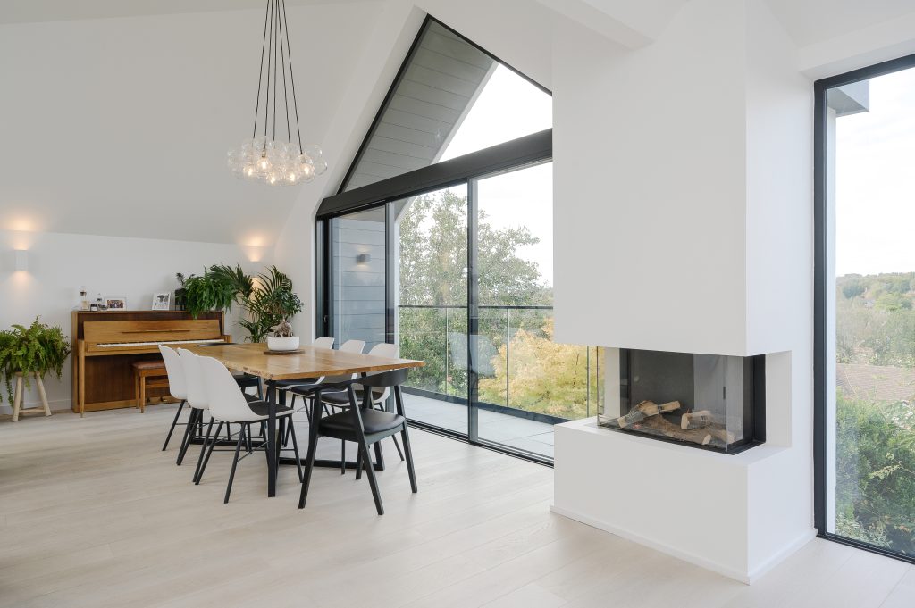 a living room filled with furniture and a large window