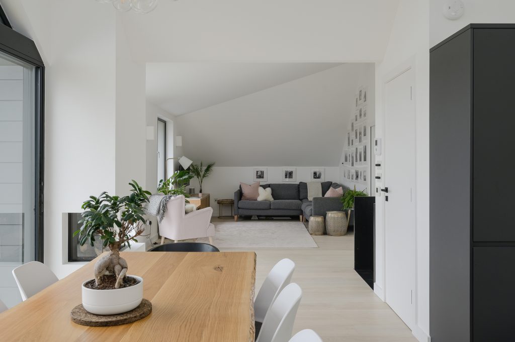 a room filled with furniture and a large window