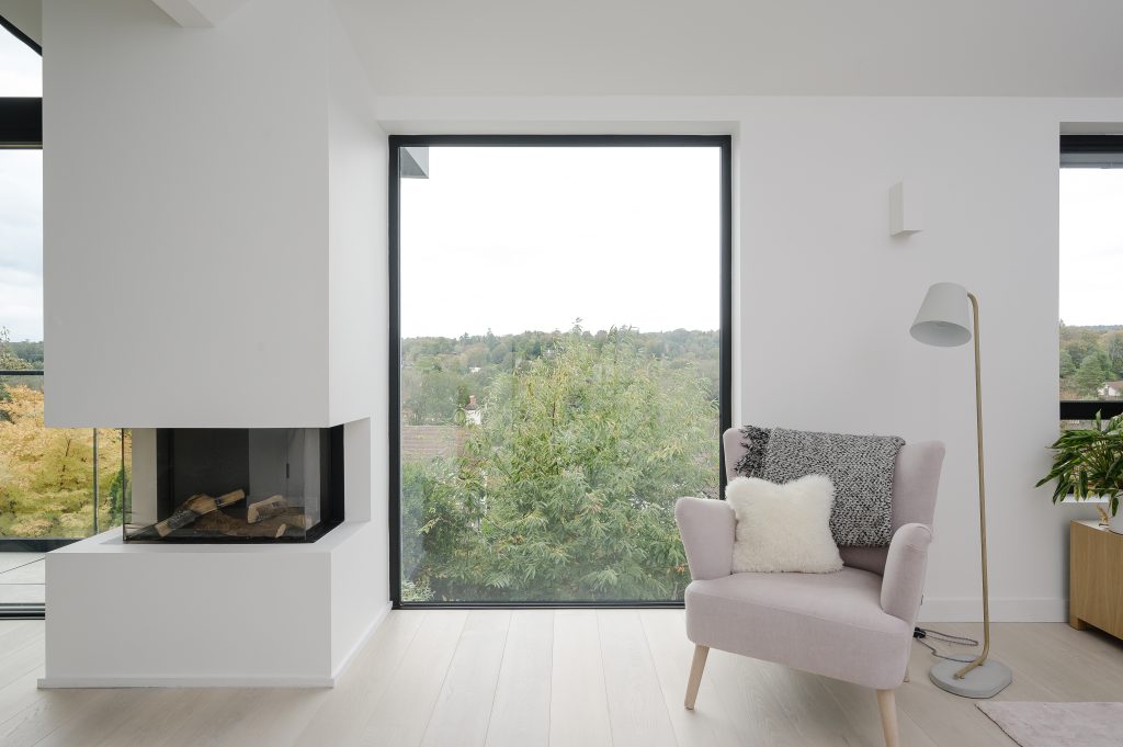 a living room filled with furniture and a large window