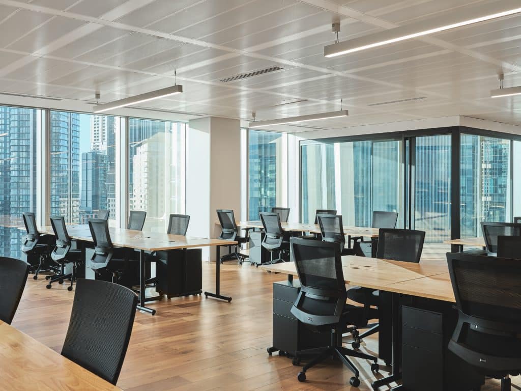 a view of a living room filled with furniture and a large window