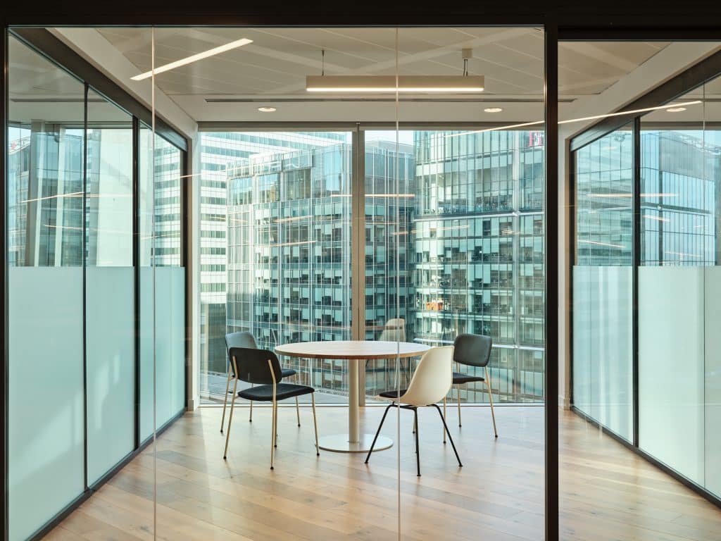 a room filled with furniture and a large window