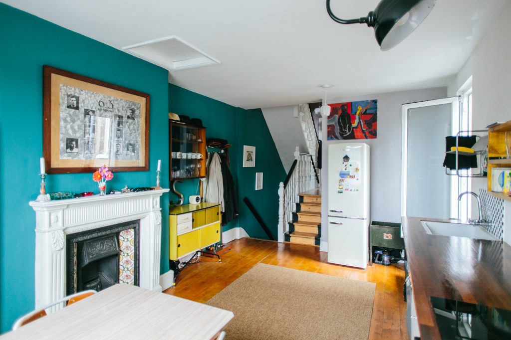 a living room filled with furniture and a fire place