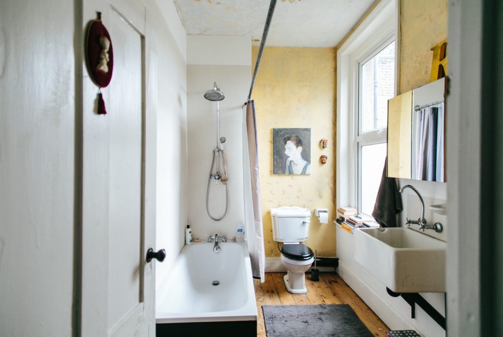 a room with a sink and a mirror