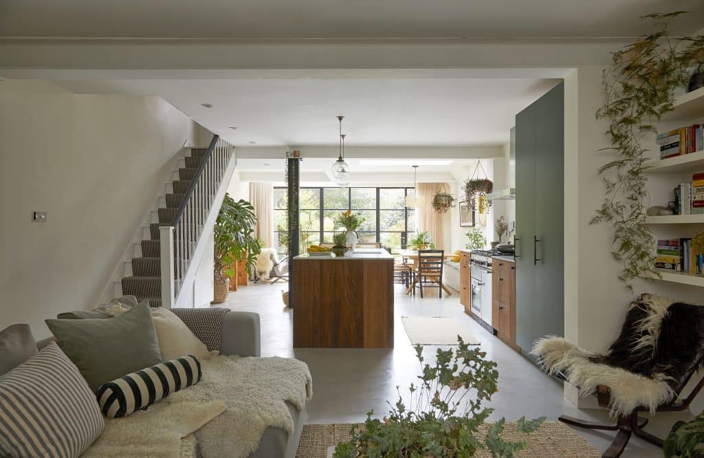 a living room filled with furniture and a fireplace