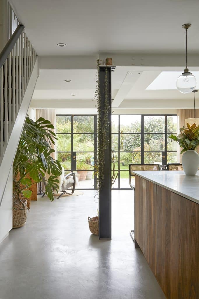 a living room filled with furniture and a table in front of a building