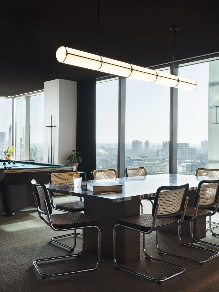 a room filled with furniture and a large window