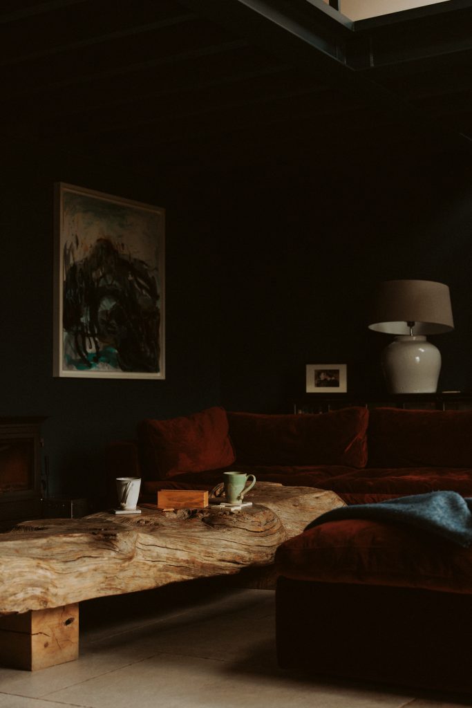 a room filled with furniture and a fireplace