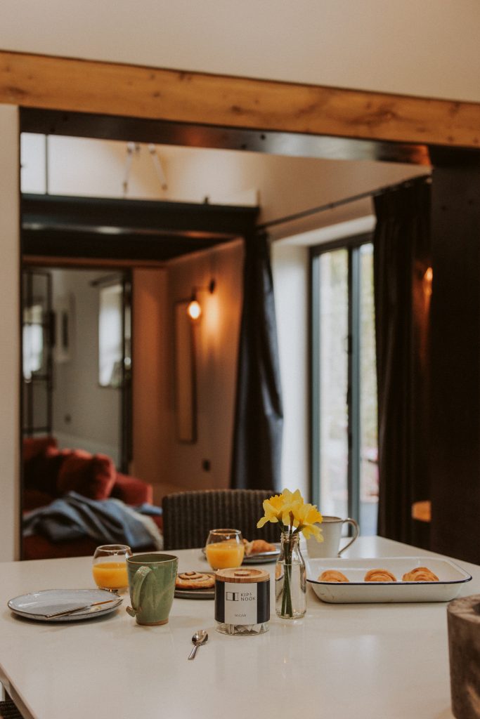 a dining room table in front of a mirror posing for the camera