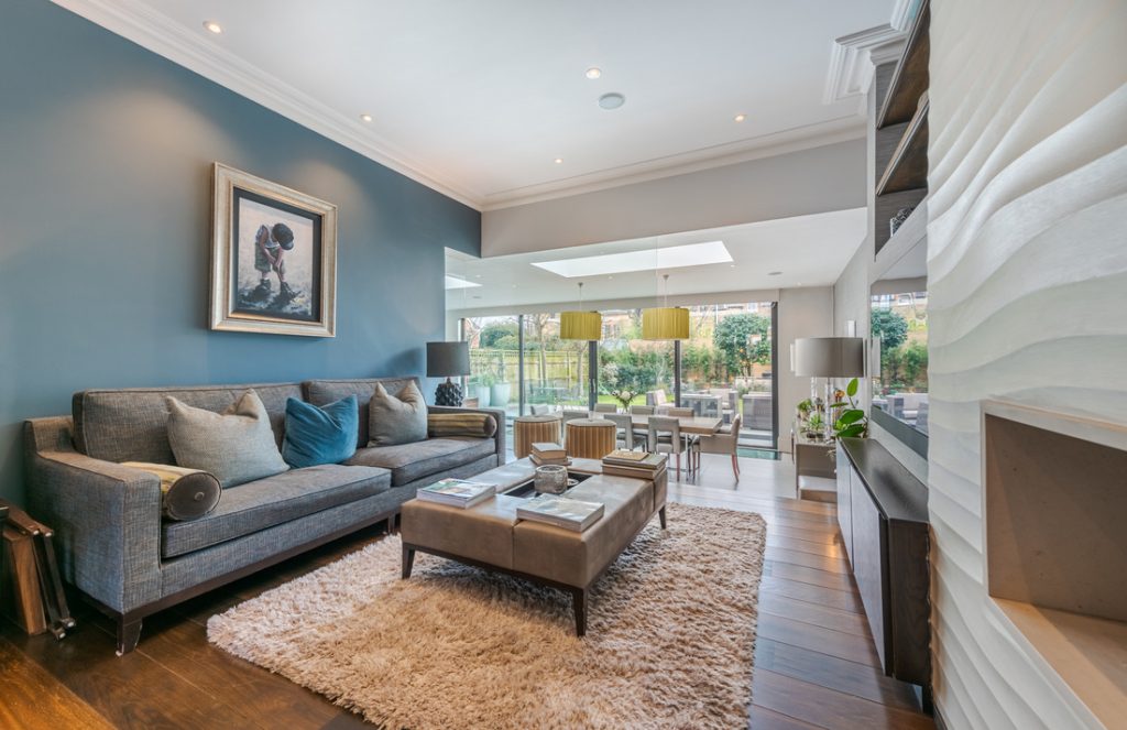 a living room filled with furniture and a large window