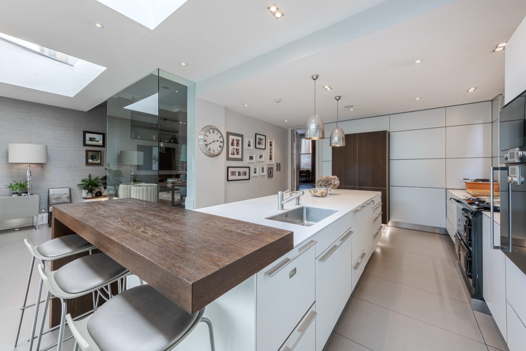 a kitchen with an island in the middle of a room