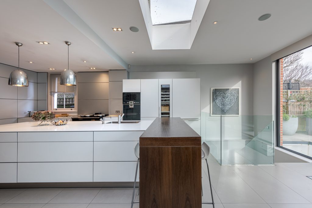 a kitchen with an island in the middle of a room