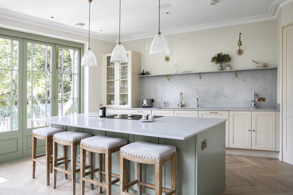 a kitchen with a table in front of a window