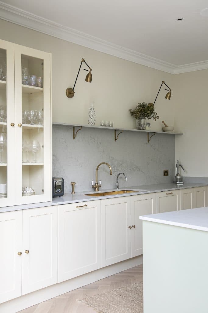 a kitchen with a sink and a mirror