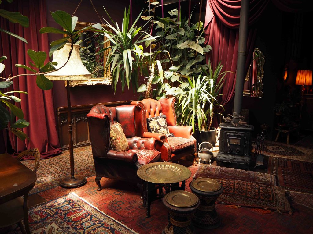 a living room filled with furniture and a fireplace