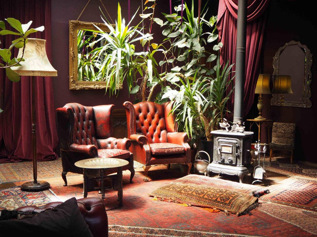 a living room filled with furniture and a fireplace