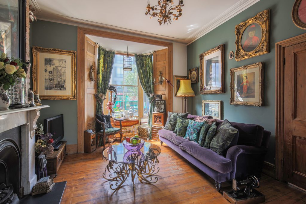 a living room filled with furniture and a fire place