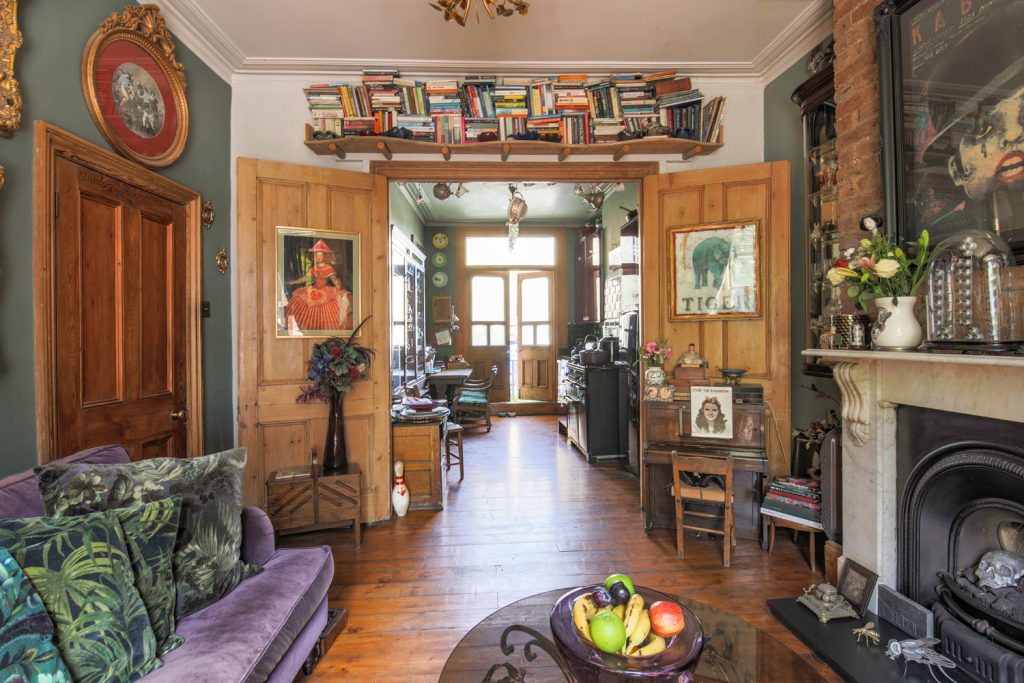 a living room filled with furniture and a fire place