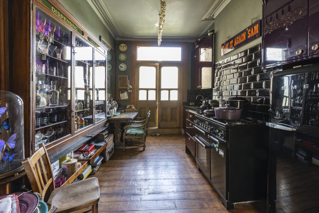 a room filled with furniture and a large window