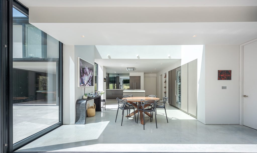 a living room filled with furniture and a large window