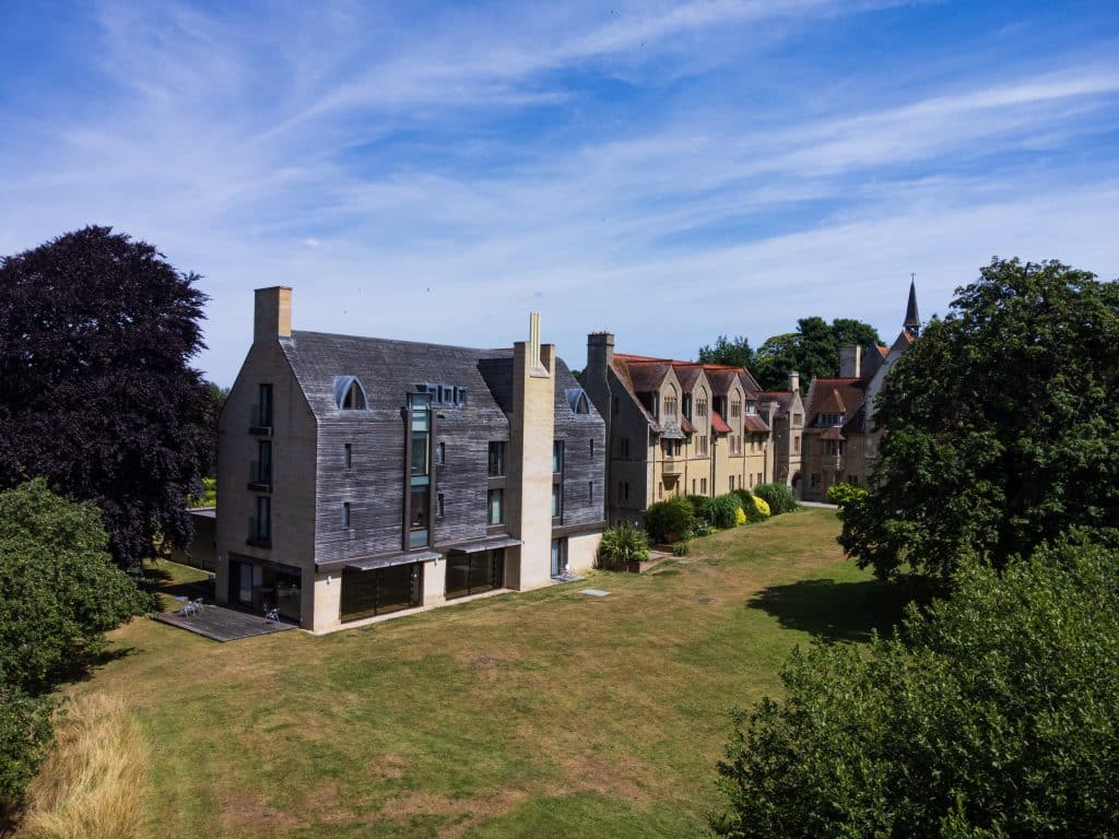 a church with a path and grass