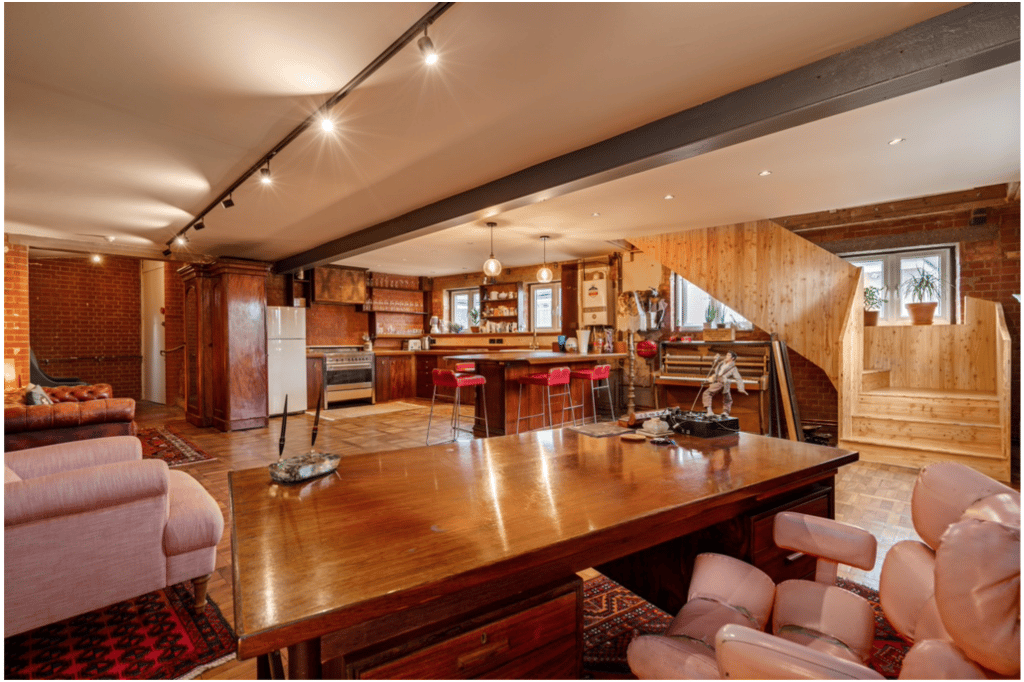 a room filled with furniture and a large window