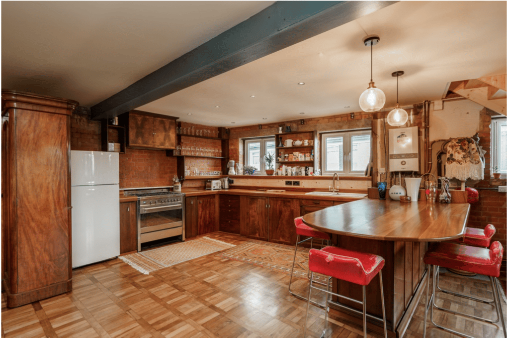 a kitchen with a wood floor