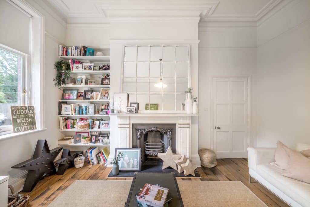 a living room filled with furniture and a large window