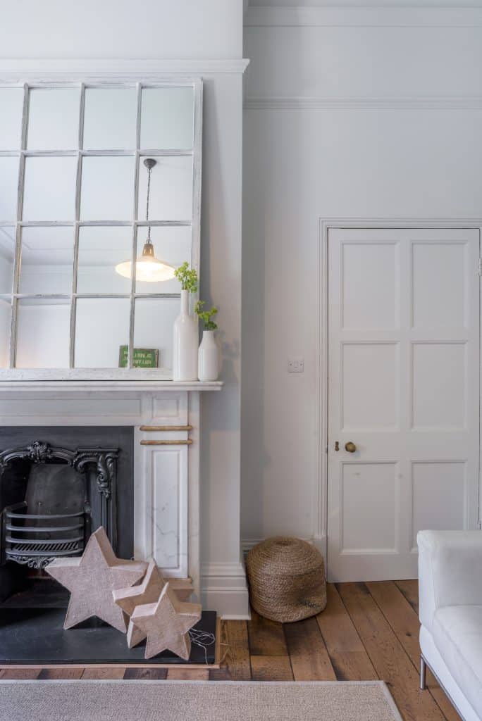 a room filled with furniture and a large window