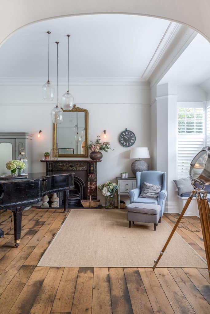 a living room filled with furniture and a fireplace