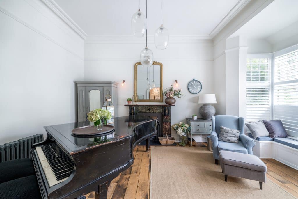 a living room filled with furniture and a large window