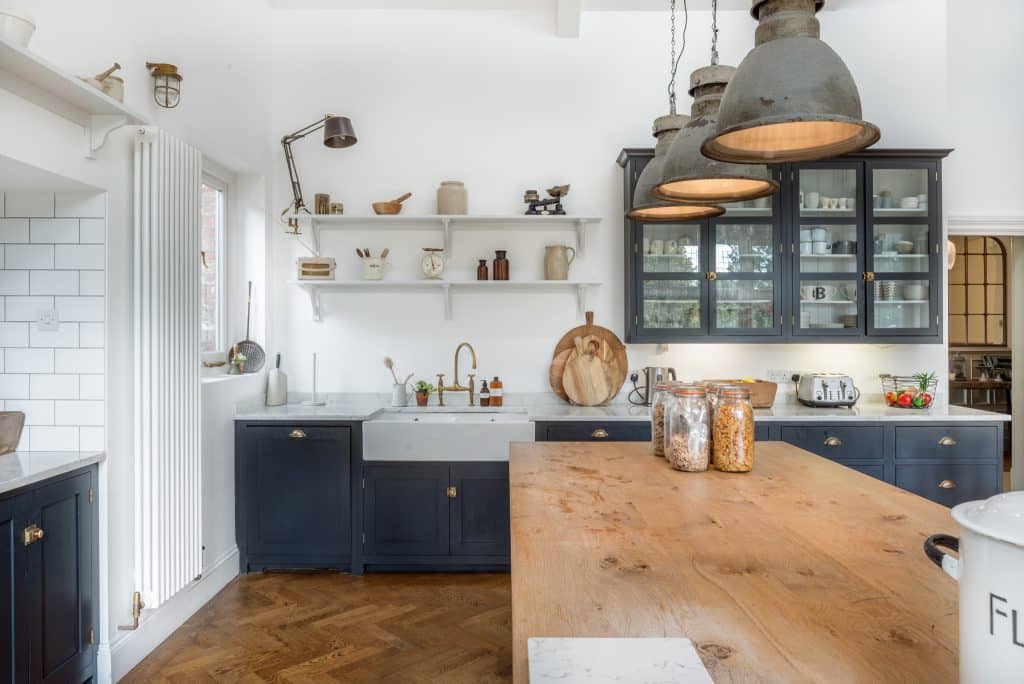 a kitchen with a sink and a mirror
