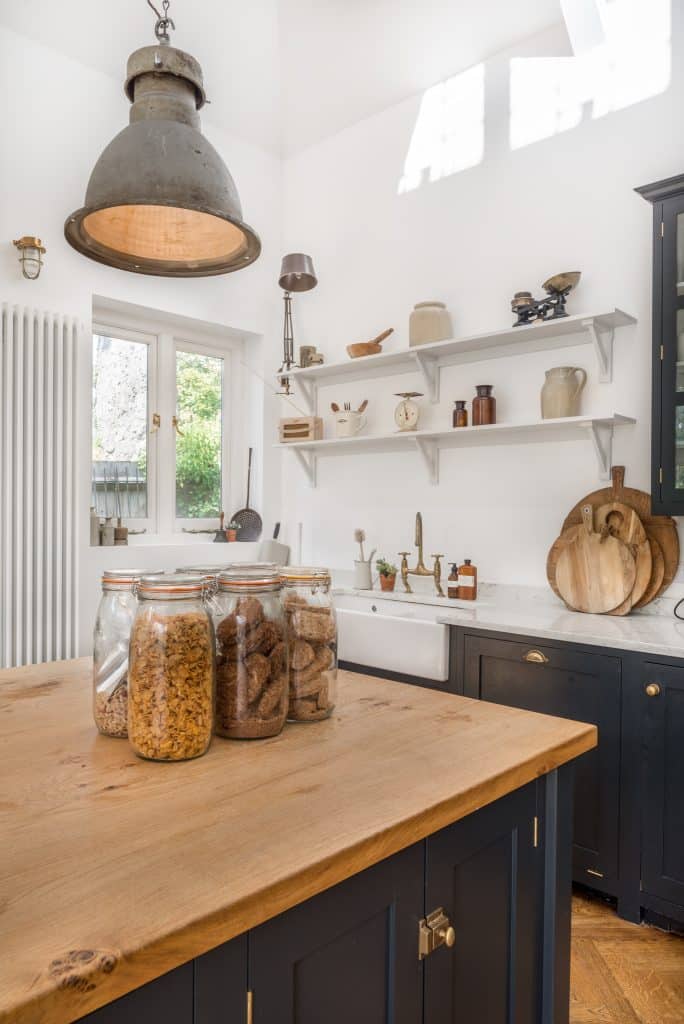 a kitchen with a sink and a mirror